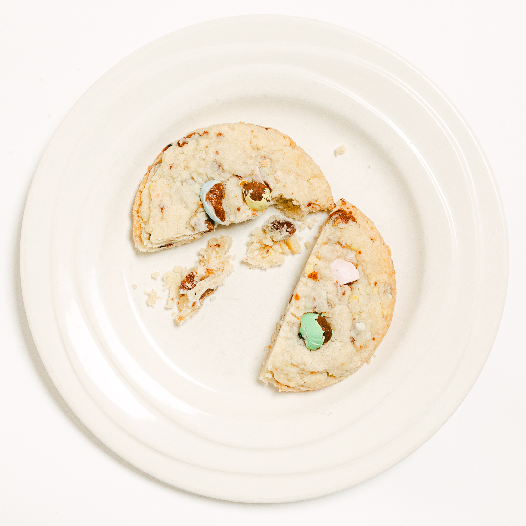 Robert Street Cookies Shortbread Mini Eggs flavour cut in half on a white plate